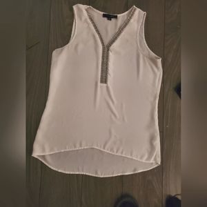 White silky shirt with jewels around the V neck line